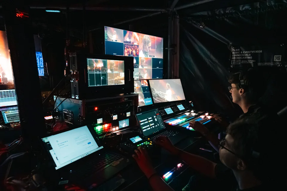 PEAK event production control team working on lighting and visuals